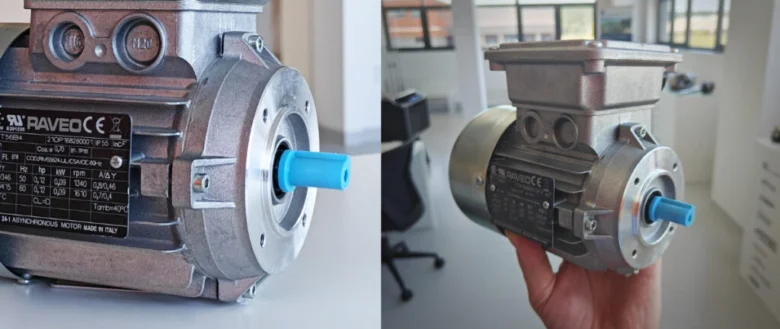 Asynchronní elektromotor značky Raveo s viditelným hřídelem.