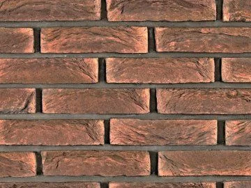 Detail textury červené cihlové fasádní obkladové dlaždice.