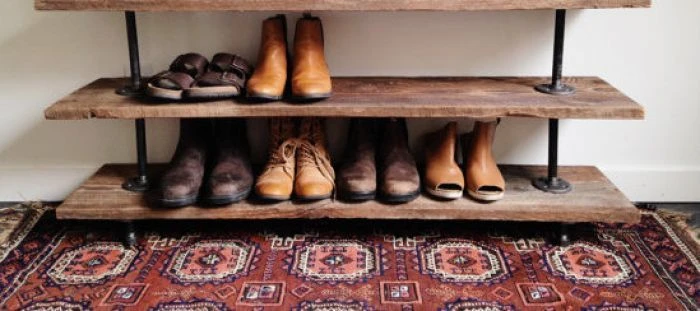 Wooden shoe rack with boots