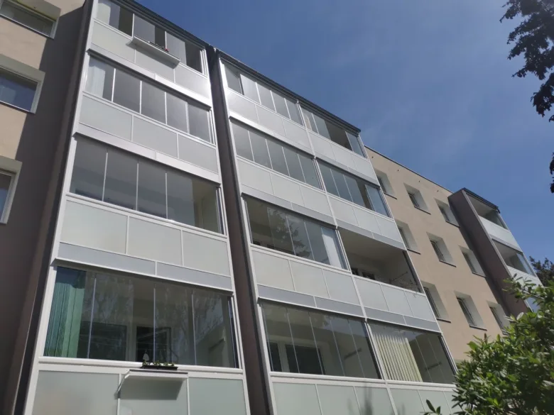 Modern apartment balconies with glass enclosures