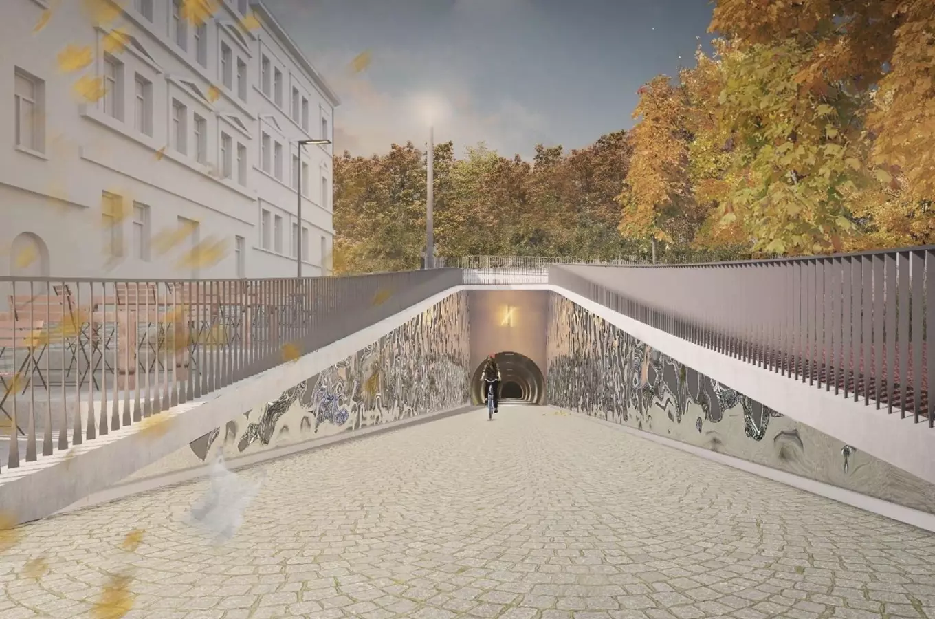 Vstup do podjezdu s uměleckými nástřiky a cyklista v autumnu.
