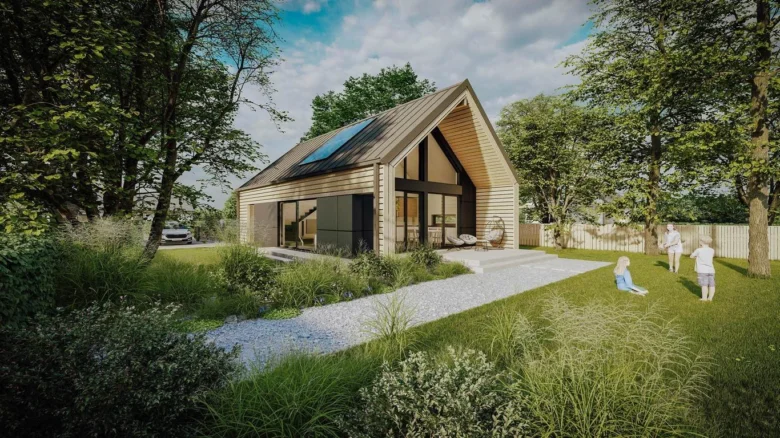 Moderní prefabrikovaný dřevěný dům v zeleném zahradním prostředí.