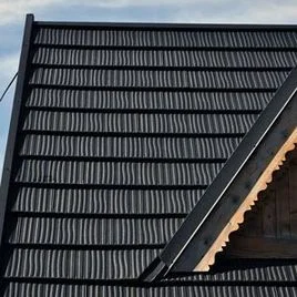 Metal roof tiles and ridge cap
